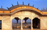 Agra Fort was originally a brick fort, held by the Hindu Sikarwar Rajputs. It was mentioned for the first time in 1080 CE when a Ghaznavide force captured it.<br/><br/>Sikandar Lodi (1488–1517) was the first Sultan of Delhi who shifted to Agra and lived in the fort. He governed the country from here and Agra assumed the importance of the second capital.<br/><br/>After the First Battle of Panipat in 1526, Mughals captured the fort. The victorious Babur stayed in the fort in the palace of Ibrahim and built a baoli (step well) in it.<br/><br/>The emperor Humayun was crowned here in 1530. Humayun was defeated at Bilgram in 1540 by Sher Shah Suri. The fort remained with Suris till 1555, when Humayun recaptured it.<br/><br/>The Hindu king Hem Chandra Vikramaditya, also called 'Hemu', defeated Humayun's army, led by Iskandar Khan Uzbek, and won Agra. Hemu got a huge booty from this fort and went on to capture Delhi from the Mughals. The Mughals under Akbar defeated King Hemu finally at the Second Battle of Panipat in 1556.<br/><br/>Realizing the importance of its central situation, Akbar made it his capital and arrived in Agra in 1558. The fort was in a ruined condition and Akbar had it rebuilt with red sandstone, completing it in 1573.<br/><br/>It was only during the reign of Akbar's grandson, Shah Jahan, that the site took on its current state.